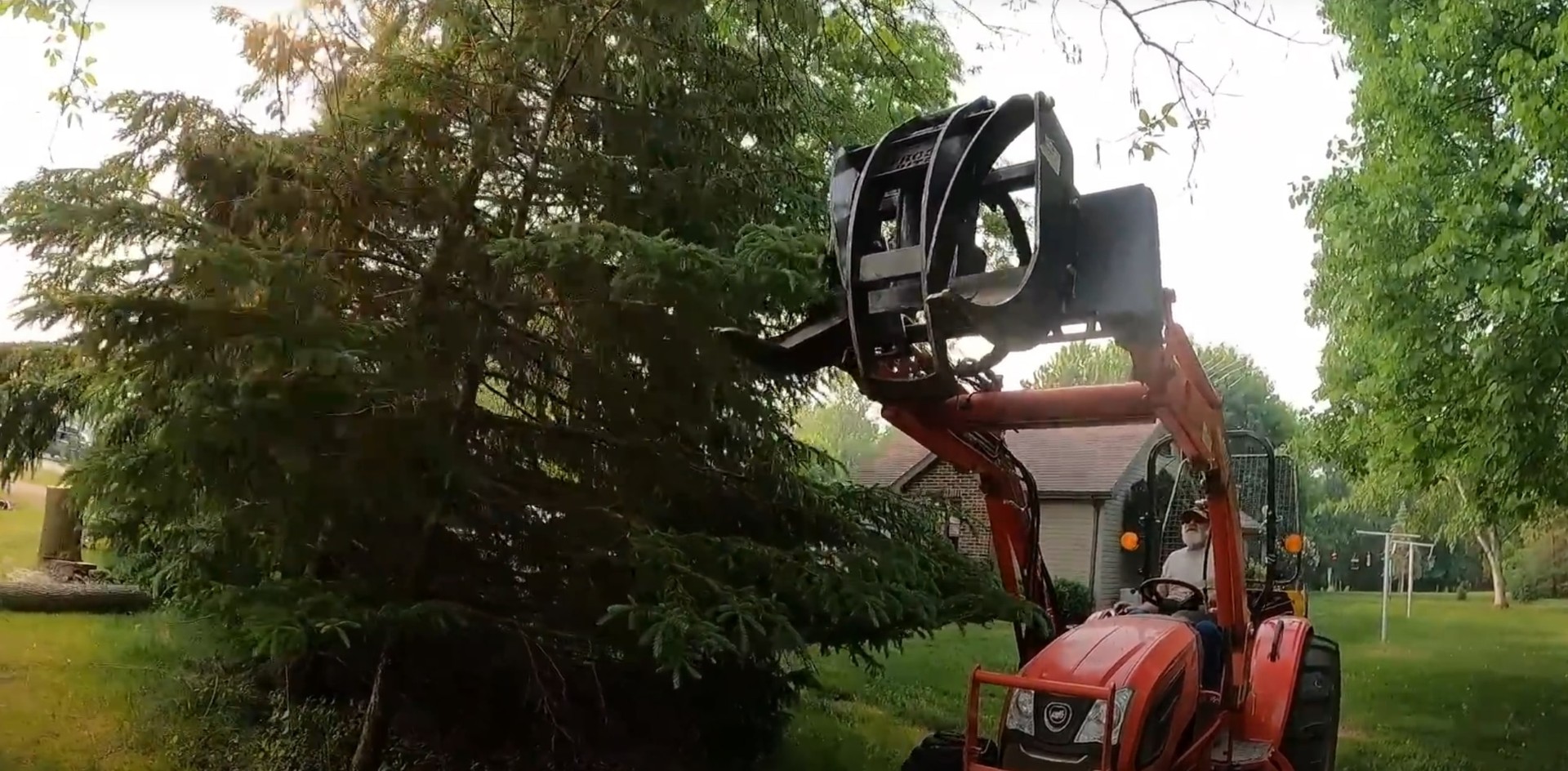 Professional equipment ensures safe and efficient tree removal Heavy machinery being used for safe professional tree removal